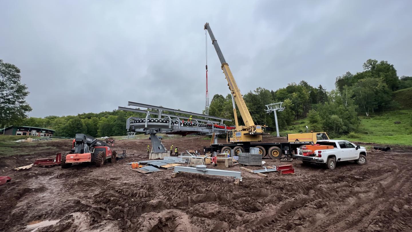 Crane assembles new chairlift terminal.
