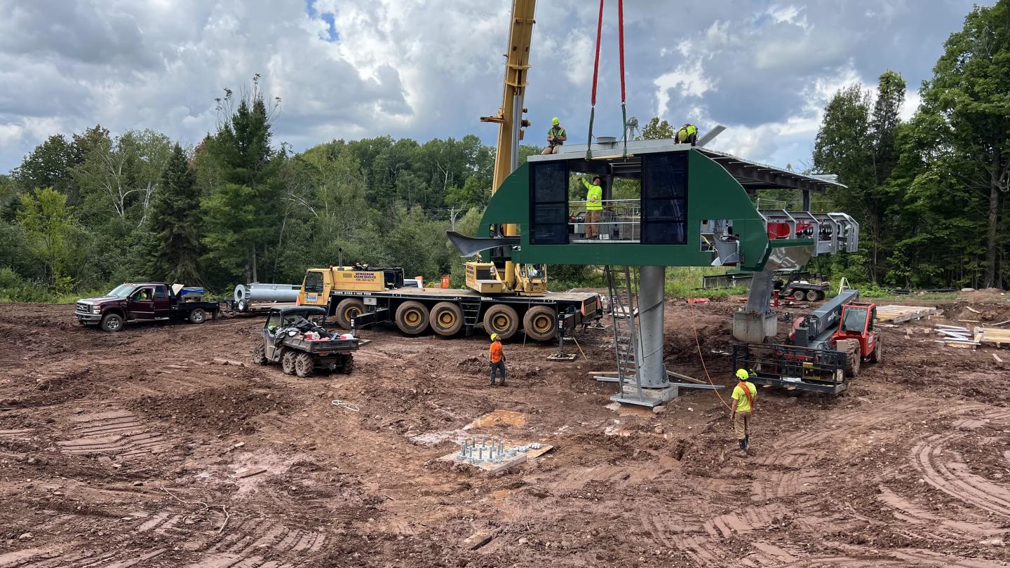 Crane assembles new chairlift terminal.