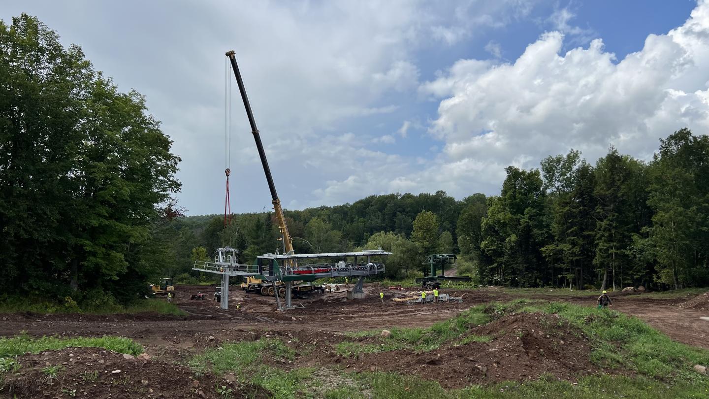 Crane assembles new chairlift terminal.