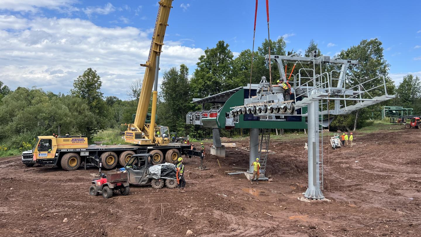Crane assembles new chairlift terminal.
